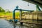 Outdoor view of blue pipeline conection under a bridge on Chao Phraya river. Thailand, Bangkok