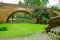 Outdoor view of brick bridge of Humilladero located in the forest surrounding of nature in colonial city Popayan