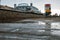 Outdoor view at the Brighton pier with reflective puddles after the rain