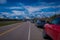 Outdoor view of cars parked at one side of the road from Yellowstone National Park to Grand Teton National Park, Wyoming