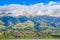 Outdoor view of house buildings at the base of Imbabura inactive stratovolcano in northern Ecuador