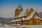 Outdoor view of the Stave Church partial covered with snow during a heavy winter season in Gol