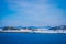 Outdoor view of wooden houses a long in the coast from Hurtigruten voyage cruise ship, Northern Norway