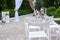 Outdoor wedding decorations, arch decorated with red and white flowers, chairs, lanterns