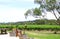 Outdoor winery picnic setting with views of rows of grapevines.