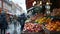 Outdoor winter market scene with blurred people and fruit stalls