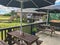 Outdoor wooden seat with umbrella for shading in restaurant in New Zealand