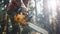 Outdoor work, lumberjack cutting timber with a powerful chainsaw. Forestry worker in action, chainsaw in hand.