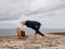 Outdoor yoga. Young woman practicing Chakrasana or Urdhva Dhanurasana. Full Wheel Pose. Deep backbend. Flexibility, strength,