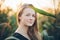 Outdoors lifestyle portrait of young adorable fresh looking redhead woman with freckles gorgeous extra long hair corn field sunny