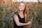 Outdoors lifestyle portrait of young adorable fresh looking redhead woman with freckles gorgeous extra long hair corn field sunny