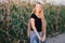 Outdoors lifestyle portrait of young adorable fresh looking redhead woman with freckles gorgeous extra long hair corn field sunny