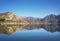 Outdoors nature landscape lake reflection calm view relaxing blue sky with mountains at background