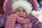 Outdoors portrait of sad little girl in winter