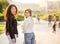 Outdoors portrait of two delightful young woman