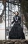 Outdoors portrait of a victorian lady in black