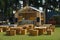 Outdoors restaurant tables and chairs and counter front in grass