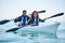 Outdoorsy couples will totally enjoy this. Portrait of a young couple kayaking together at a lake.