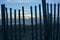 The Outer Banks sunrise as seen through the erosion control wood and wire fencing