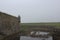 The outer wall of the fortress of Louisbourg, Cape Breton Island, on a foggy day