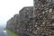 The outer wall of the fortress of Louisbourg, Cape Breton Island, on a foggy day