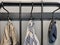 Outerwear, coat hanging on a hook of a coat rack in hallway, anteroom at home