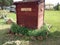 Outhouse with Wildflowers growing around it