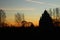 The outline of the Church at sunset , religion , Christian Church , yellow and blue sky , the outlines of the trees