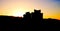 Outlines of residential tall houses with sunset sky.