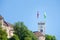 Outlook tower, also called viewing tower or Razgledni stolp, taken from downhill in Ljubljana castle with the flag of the city.