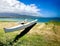 An outrigger canoe sits waiting for people to paddle it out into the bay of Kahului, Maui, Hawaii.