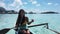 Outrigger Canoe - woman paddling in traditional French Polynesian Canoe