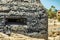 Outside detailed view of loophole of old military bunker on the south coast of El Medano. Tenerife, Canary Islands, Spain