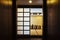 Outside of Japanese style dining room with wooden table in the center and eight cushion seats decorated in earth tone