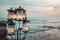 Outside lanterns with candles on ocean background. Romantic sunset on sea coast. Bali, Canggu.