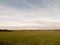 outside open field summer spring day sky clouds plain grass