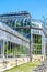 Outside of steamy conservatory greenhouse under blue sky with moon