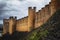 Outside stone walls of the convent of christ in Tomar, Portugal