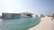 Outside view on the famous Louvre Museum in Abu Dhabi with some tourists around