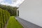 Outside view of suburban house with big window green lawn