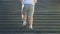Outsize man running up on stairs, cardio workout outdoors, motivation and sport