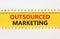 Outsourced marketing symbol. Concept words Outsourced marketing on beautiful yellow paper. Beautiful white paper background.
