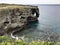 The outstanding cliff and a dazzling view of emerald ocean at Cape Manzamo in Japan.