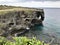 The outstanding cliff and a dazzling view of emerald ocean at Cape Manzamo in Japan.