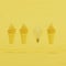 Outstanding light bulb floating among yellow ice-cream cones on yellow background