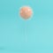 Outstanding orange balloon full of thorns on blue background for copy space