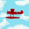Outstanding Red Plane flying over clouds from the most dominant