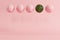 Outstanding watermelon floating among pastel pink balloons on pastel pink background for copy space