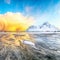 Outstanding  winter scenery on Skagsanden beach with illuminated clouds during sunrise