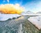 Outstanding  winter scenery on Skagsanden beach with illuminated clouds during sunrise